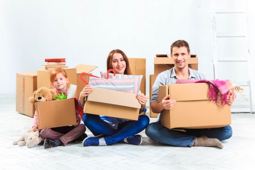 Moving team in Nottinghill unloading boxes at a new house