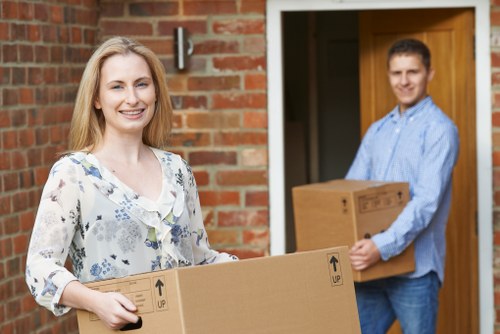 Specialist movers preparing equipment for piano transport in Nottinghill
