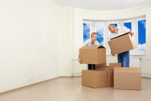 Organised furniture removals service preparing items for transport in Nottinghill