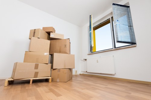Professional movers handling household furniture in Notting Hill