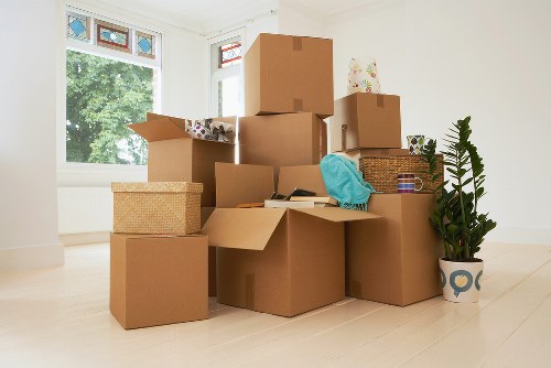 Professional movers handling flat removals in Notting Hill on a narrow London street