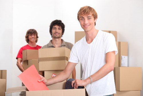 Supervisor reviewing safety procedures with moving staff before a job